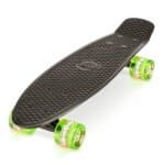 Black skateboard with transparent green and pink wheels for outdoor fun.