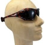 Goggles with black and red pattern for outdoor sports and protection.