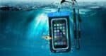 Waterproof underwater phone case with fish and surfboard strap for outdoor fun.