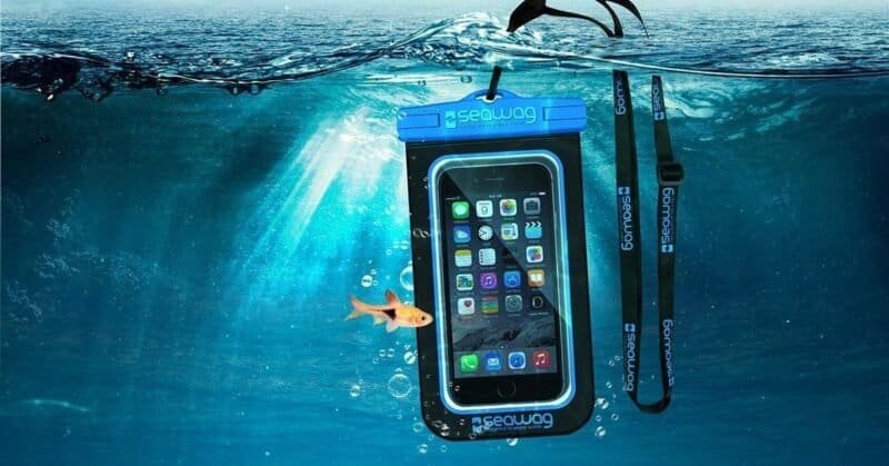 Waterproof underwater phone case with fish and surfboard strap for outdoor fun.