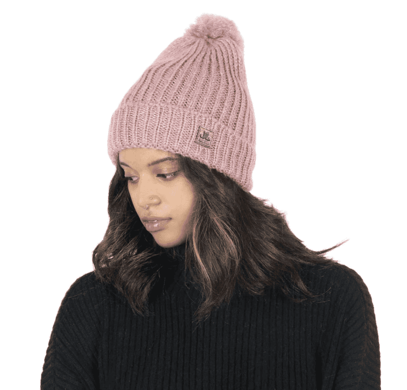 Knitted pink beanie with pom-pom, perfect for outdoor winter style.