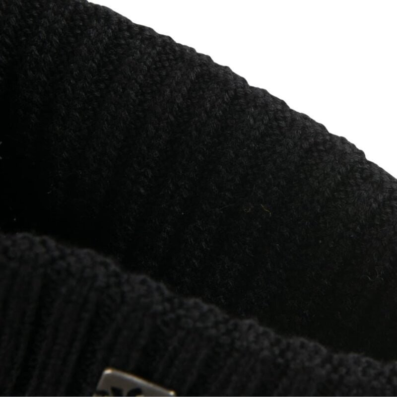 Black dress fabric with texture and detailing.