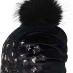 Warm black winter hat with plush pompon and glitter details.